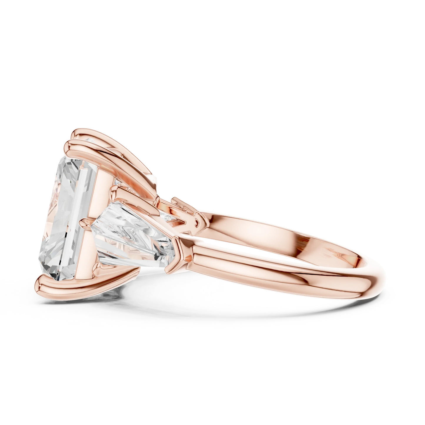 Side view of rose gold radiant three stone ring highlighting trillion side stones and diamond setting