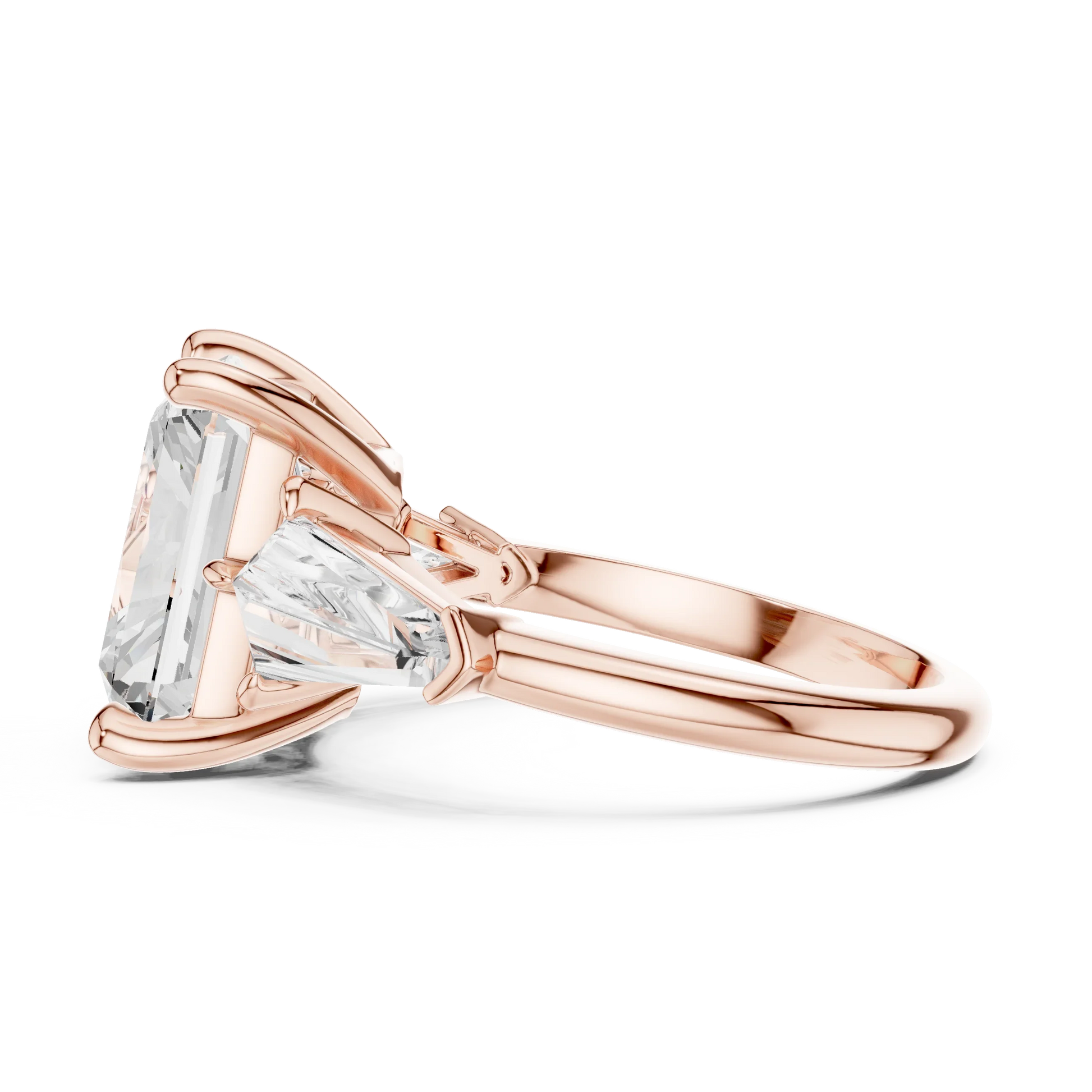 Side view of rose gold radiant three stone ring highlighting trillion side stones and diamond setting