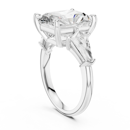 Back view of white gold radiant three stone ring featuring trillion side stones and polished band
