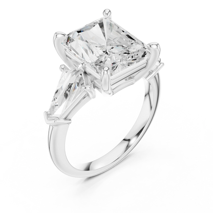 Front view of white gold radiant three stone ring with trillion side stones and lab-grown diamonds