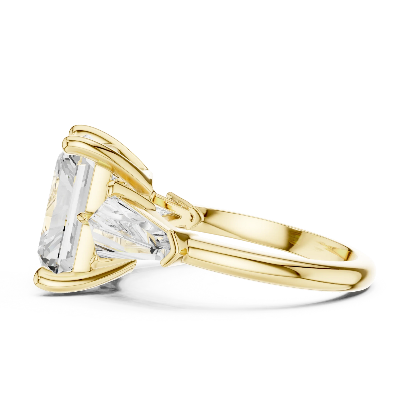 Side profile of yellow gold radiant three stone ring highlighting trillion side stones and structure