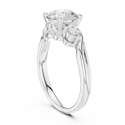 Back view of white gold three stone ring with twisted vine shank and round brilliant side diamonds