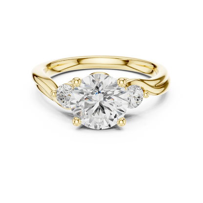 Round brilliant three stone ring with side diamonds on twisted vine shank in yellow gold with classic luxury appeal