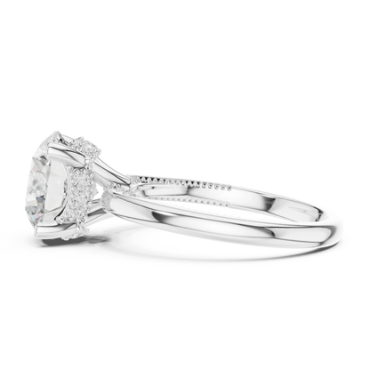 Side view of white gold round cut solitaire ring highlighting hidden halo and domed band design