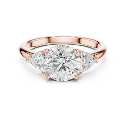 Round three-stone ring in rose gold with trillion cut side stones and lab-grown diamond 鈥?Australia