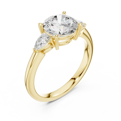 Front view of yellow gold round three-stone ring with pear side stones and lab-grown diamond 鈥?Australia