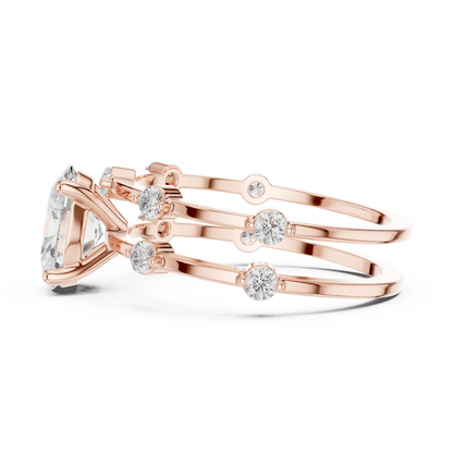 Split shank rose gold ring with center oval lab-grown diamond and side stones side view