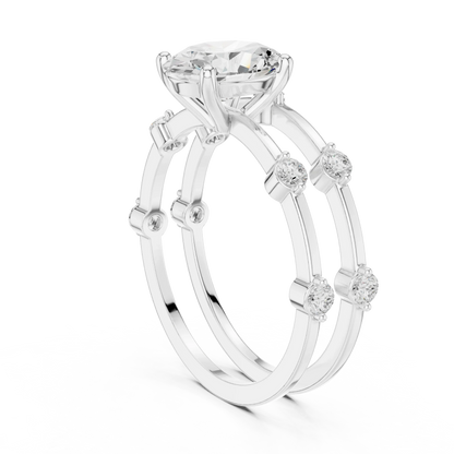 Split shank white gold ring with center oval lab-grown diamond and side stones back view