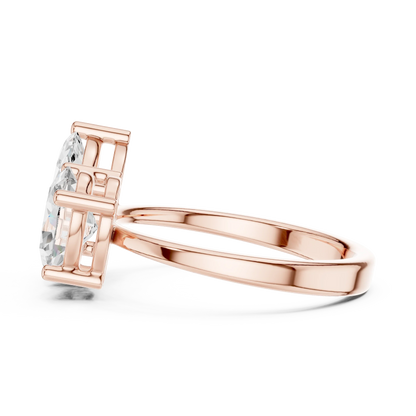Side view of rose gold Toi et Moi ring highlighting marquise and oval diamond setting