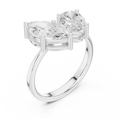 Front view of white gold Toi et Moi ring featuring marquise and oval lab-grown diamonds
