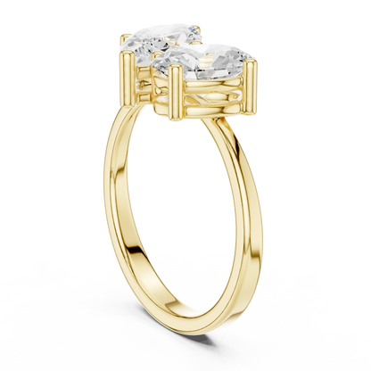 Back view of yellow gold Toi et Moi ring with marquise and oval lab-grown diamonds and smooth band