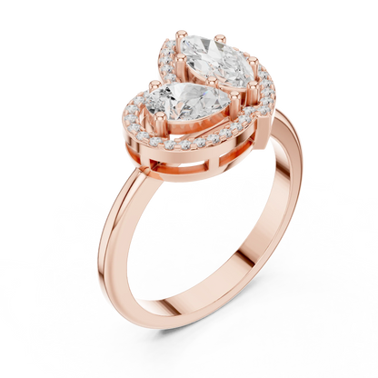 Front view of rose gold Toi et Moi ring featuring marquise and pear lab-grown diamonds with pavé halo design