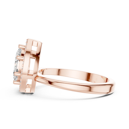 Side view of rose gold Toi et Moi ring highlighting marquise and pear diamonds with pavé halo and split shank