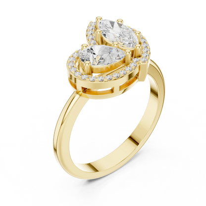 Front view of yellow gold Toi et Moi ring featuring marquise and pear lab-grown diamonds with pavé halo detailing
