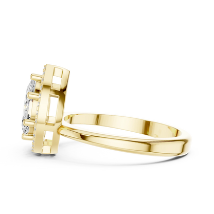 Side profile of yellow gold Toi et Moi ring highlighting marquise and pear diamonds with halo and split shank