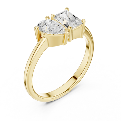 Front view of yellow gold Toi et Moi ring showcasing pear and radiant lab-grown diamonds