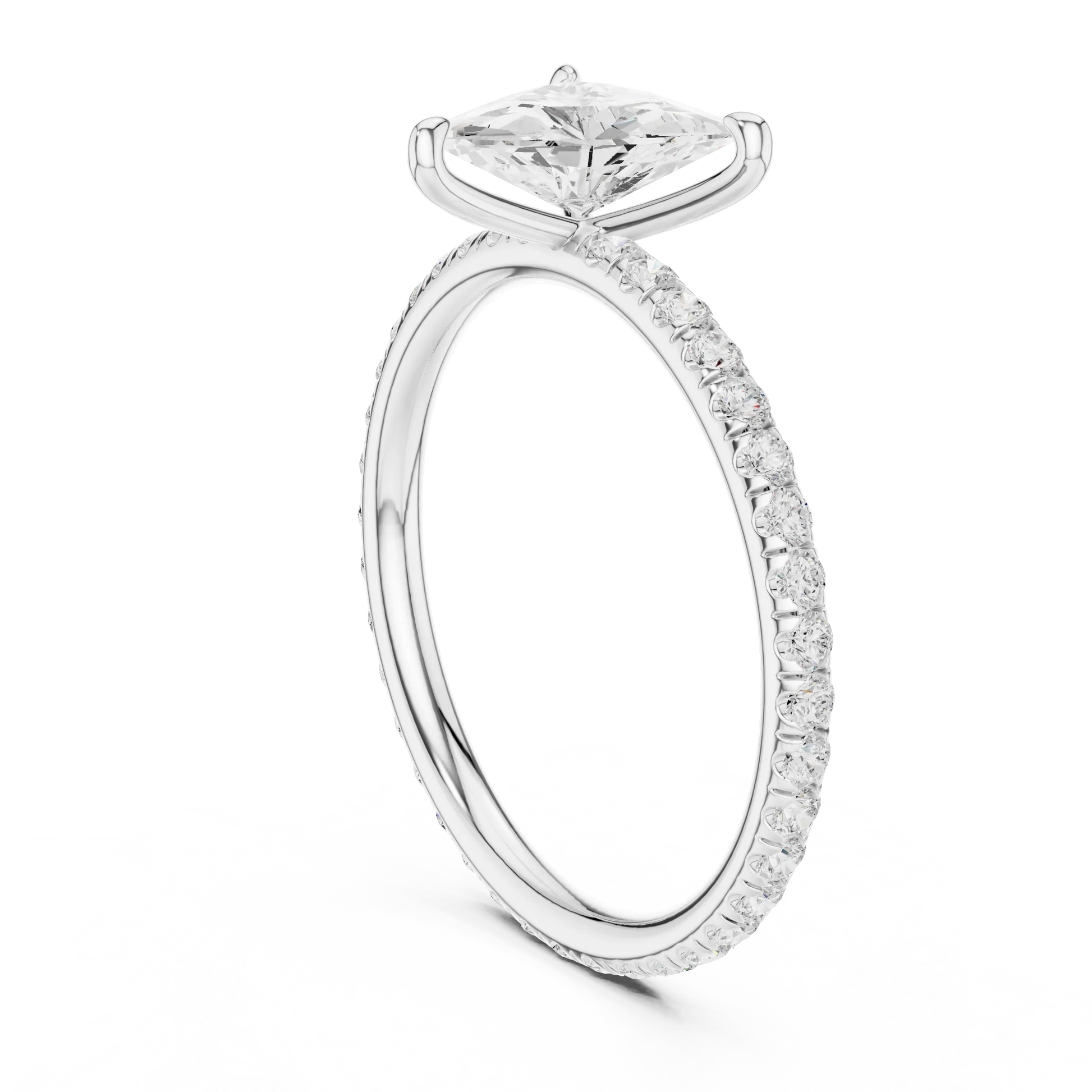 Back side view of white gold trillion cut solitaire ring showing pavé band and setting details