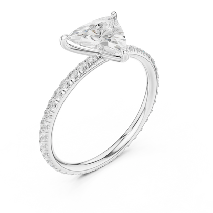 Front view of white gold trillion cut solitaire ring with thin pavé diamond band and center stone