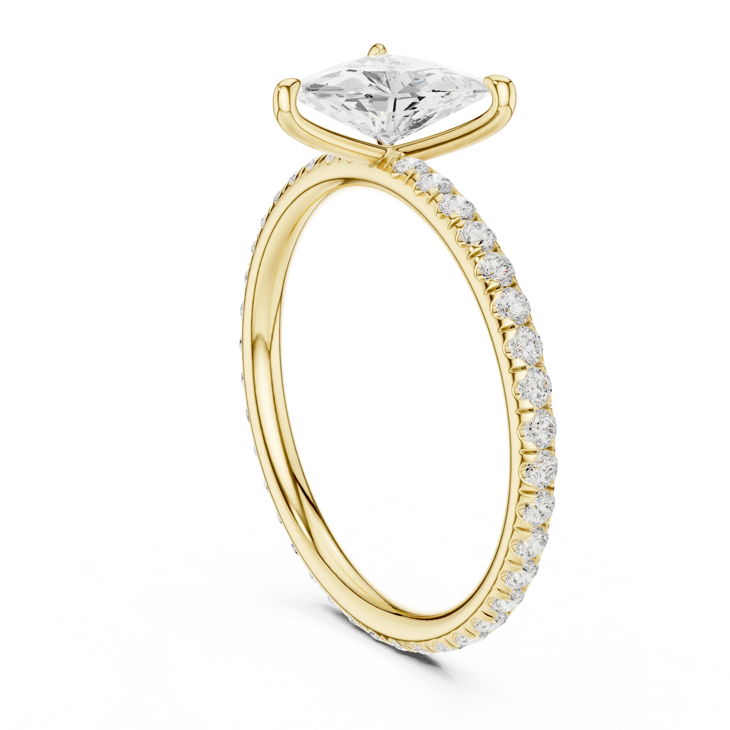 Back side view of yellow gold trillion cut solitaire ring showing pavé band and setting structure