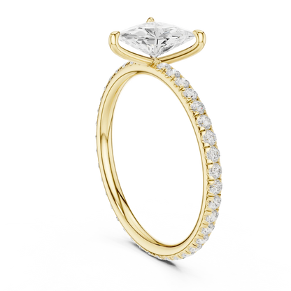 Back side view of yellow gold trillion cut solitaire ring showing pavé band and setting structure