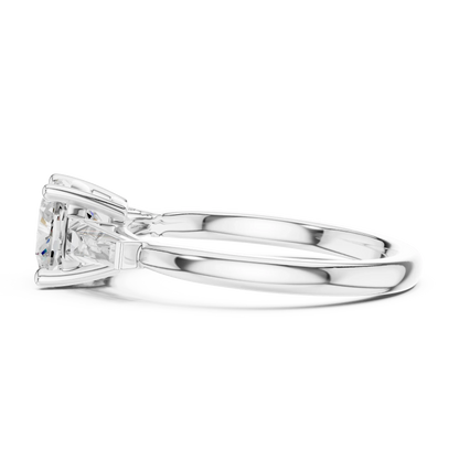 Side view of white gold cushion cut diamond trinity ring with three-stone setting