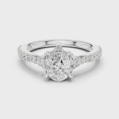 Lynden Pear Three-Stone Pav茅 Diamond Ring