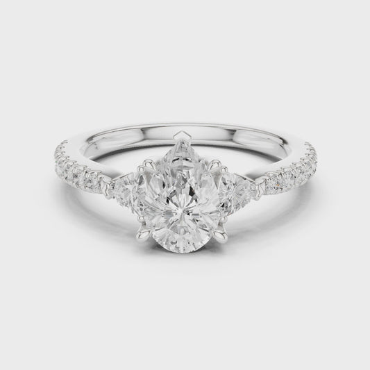Lynden Pear Three-Stone Pav茅 Diamond Ring