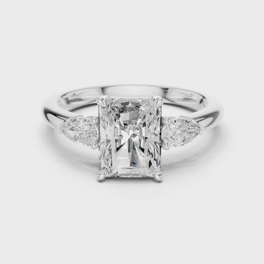 Clarion Radiant Emerald Three-Stone Diamond Ring